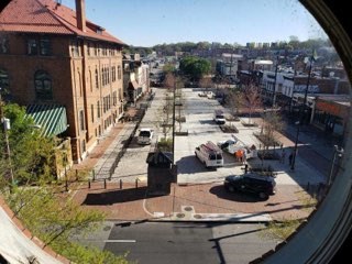 a view of a city street from a round window